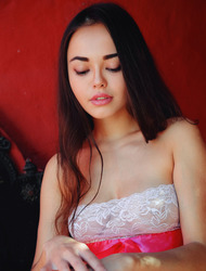 Sexy Li Moon wears a dress with a see-through front